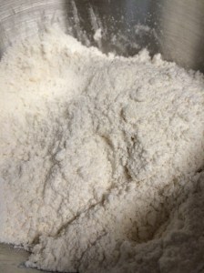 After cutting in the butter, the flour should have a cornmeal-like texture